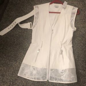 White Mini dress has two zip down-pockets .